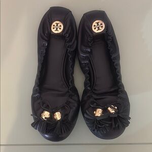 Tory Burch Black and Gold Flats with Logo Medallion